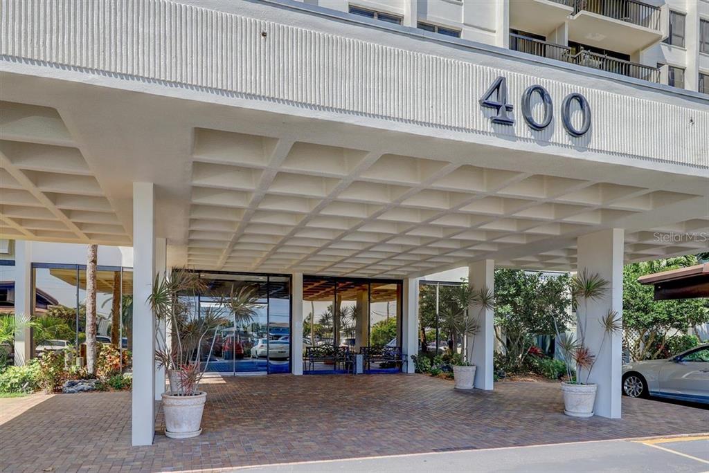 400 Island Way, Unit 308 Clearwater, FL 33767 - Photo 26 of 32 a front view of a building with street