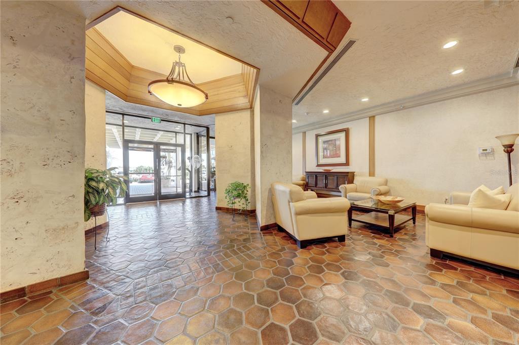 400 Island Way, Unit 308 Clearwater, FL 33767 - Photo 30 of 32 a living room with furniture and wooden floor