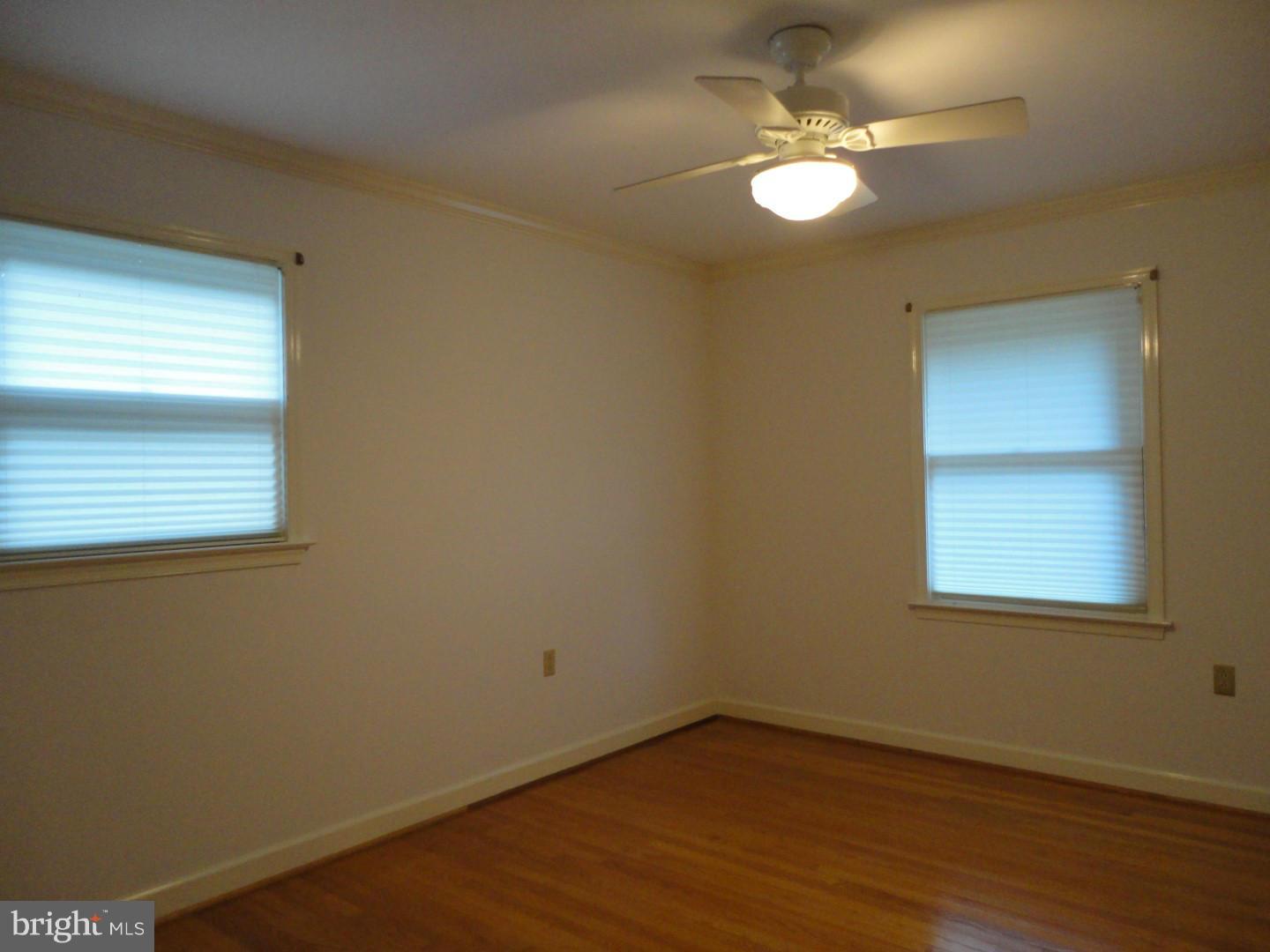2106 Hamilton Road Louisa, VA 23093 - Photo 18 of 30 an empty room with wooden floor and windows