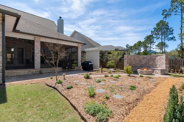 a living room with furniture a table and a fireplace