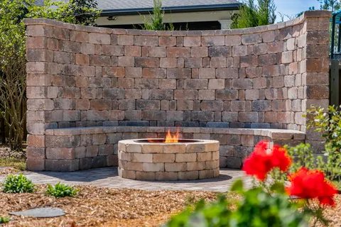 a living room with furniture a flat screen tv and a table