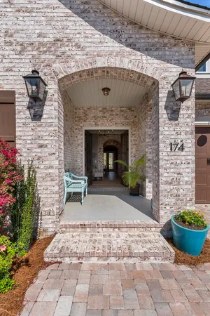 a large kitchen with a table and chairs