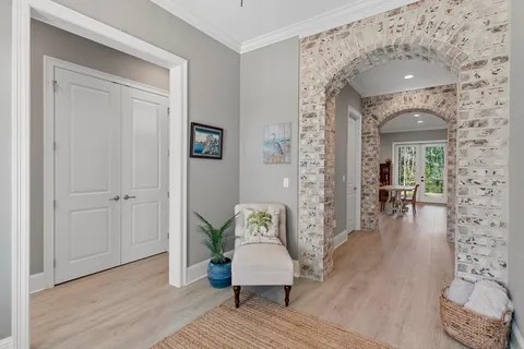 a kitchen with stainless steel appliances granite countertop a lot of counter space and wooden floors