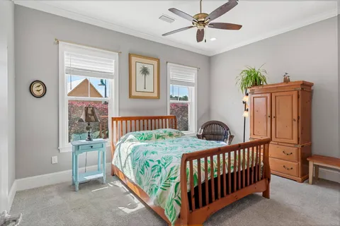 a large kitchen with kitchen island a chandelier a sink a center island and stainless steel appliances