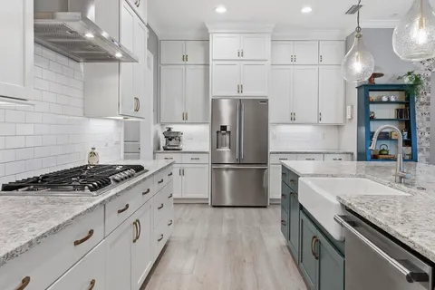 a view of swimming pool with lawn chairs and large trees