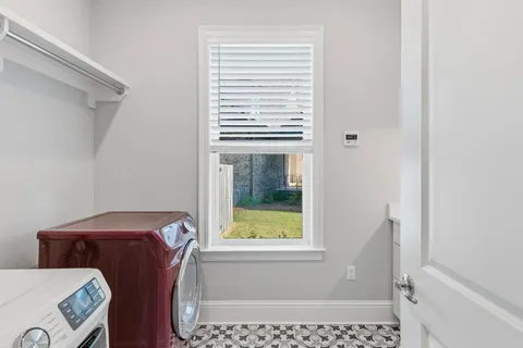 an aerial view of a house with a swimming pool yard and outdoor seating