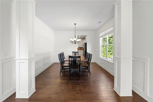 a dining room with furniture and window