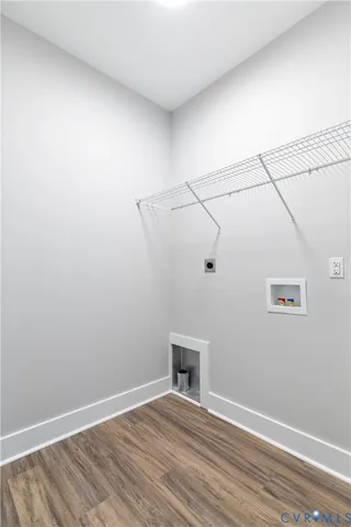 a view of a room with wooden floor