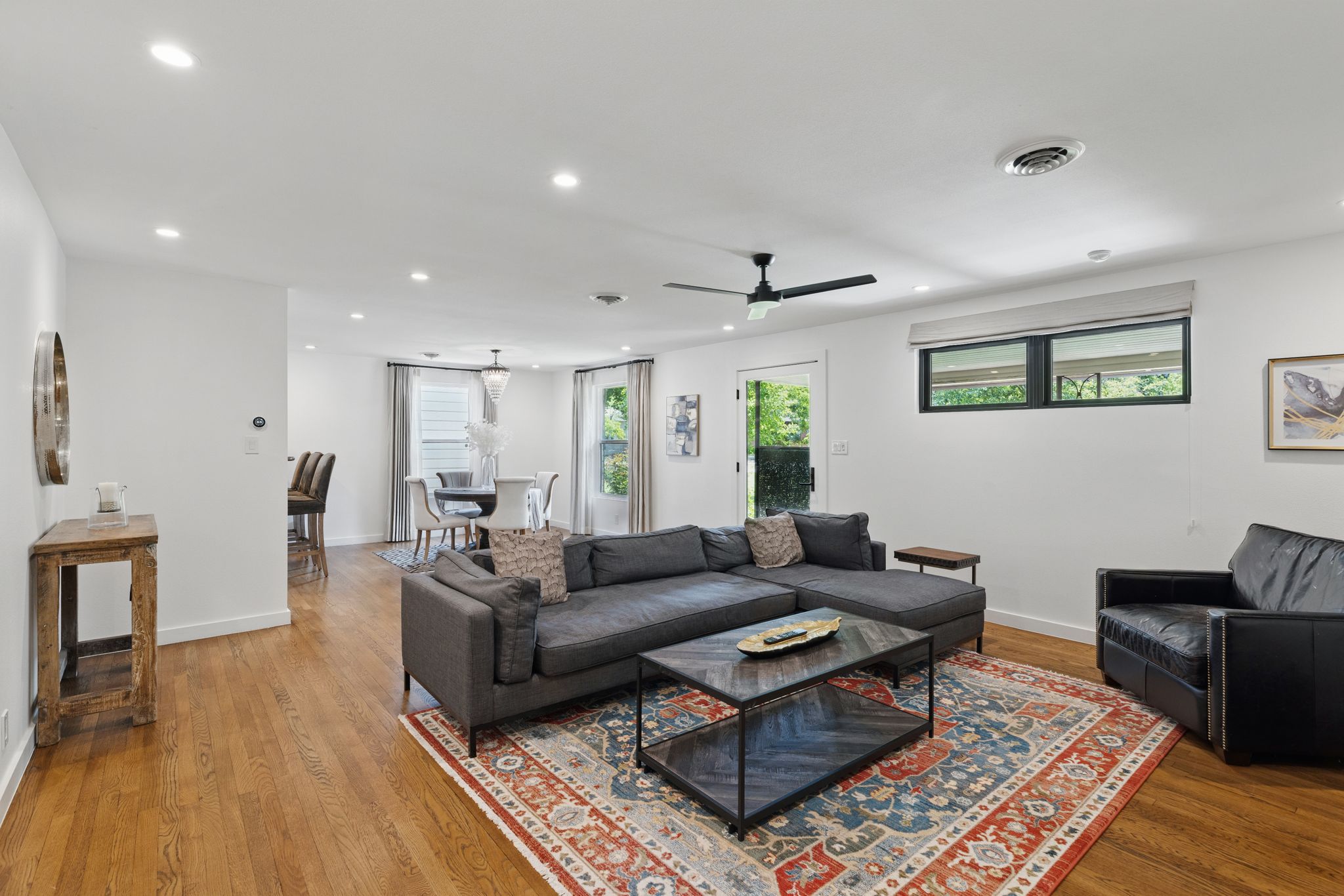 6010 Nasco Drive Austin, TX 78757 - Photo 12 of 34 a living room with furniture a rug and a wooden floor
