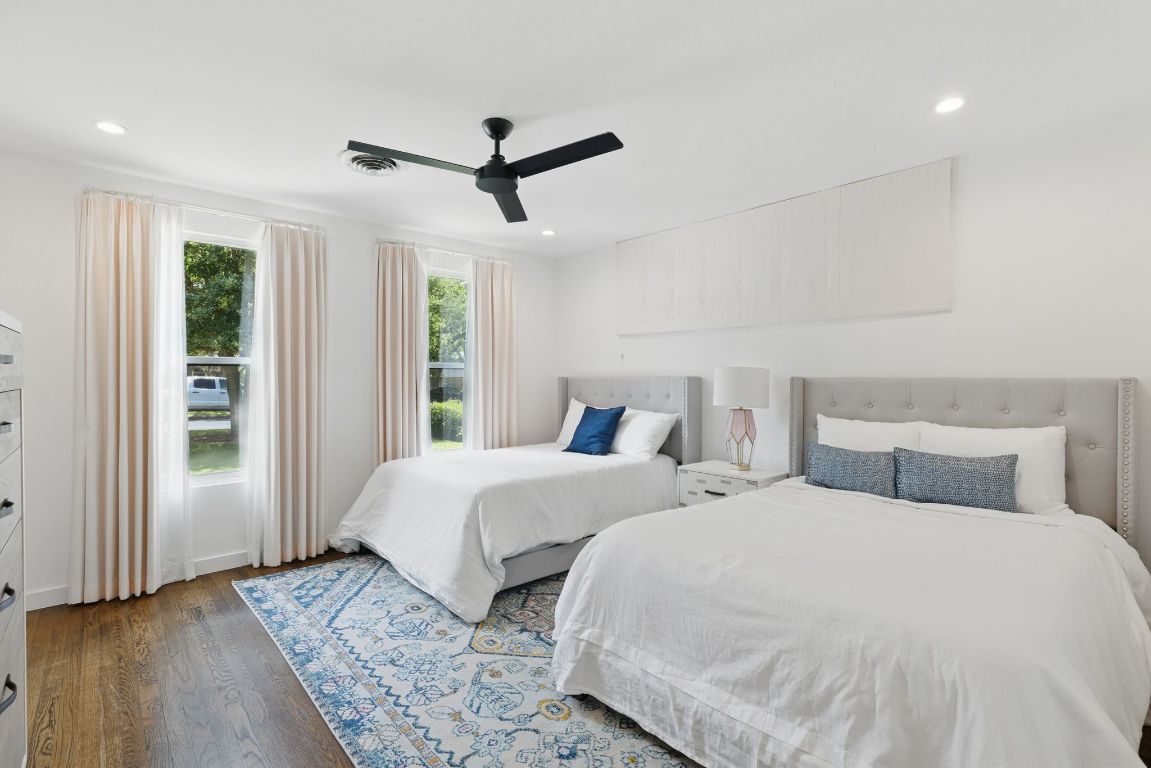 6010 Nasco Drive Austin, TX 78757 - Photo 13 of 34 a bedroom with two large bed and a window