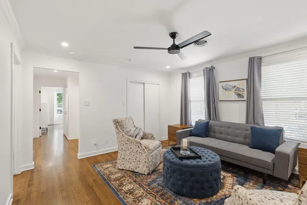 a living room with furniture and a rug