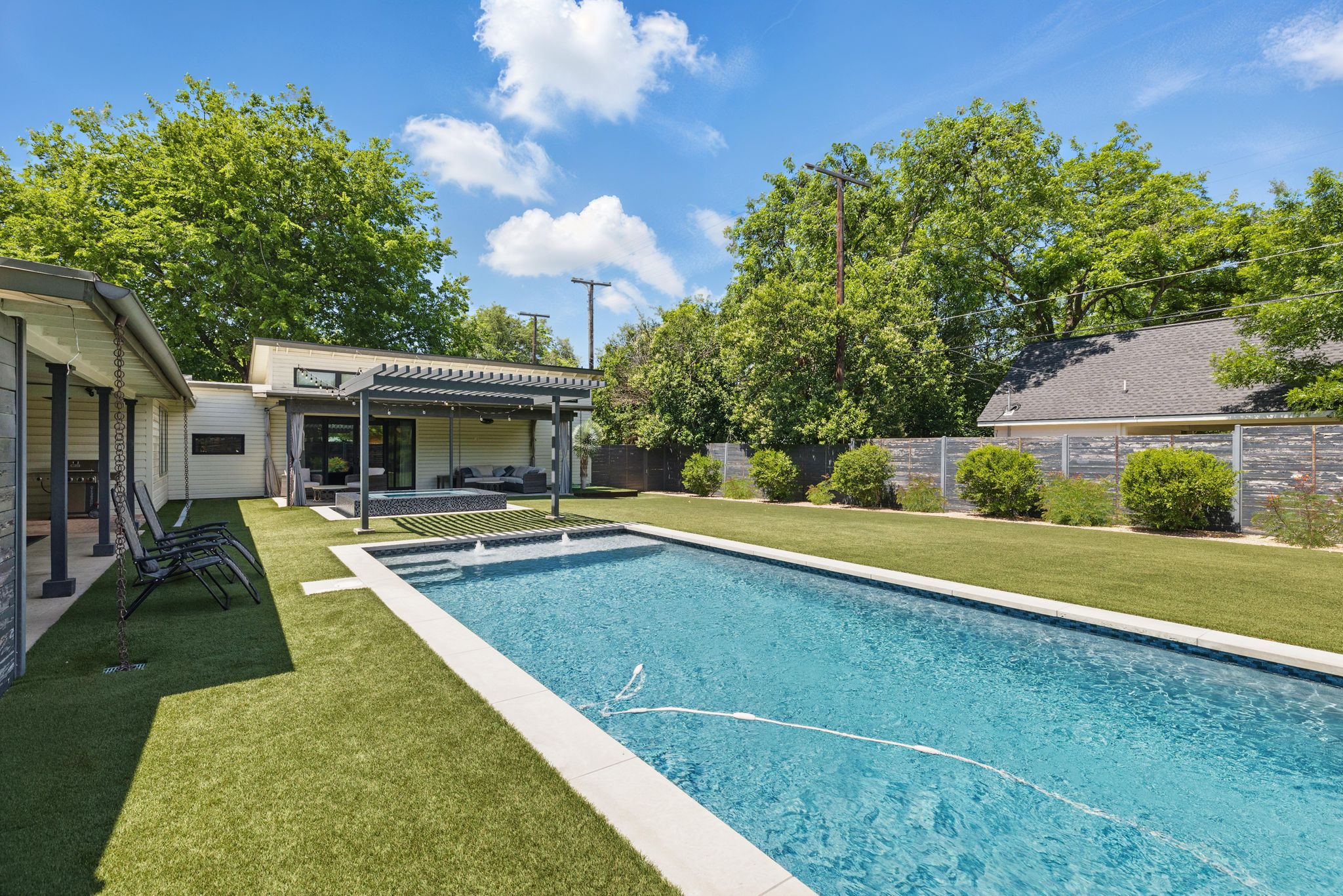 6010 Nasco Drive Austin, TX 78757 - Photo 25 of 34 a view of a house with swimming pool and a yard