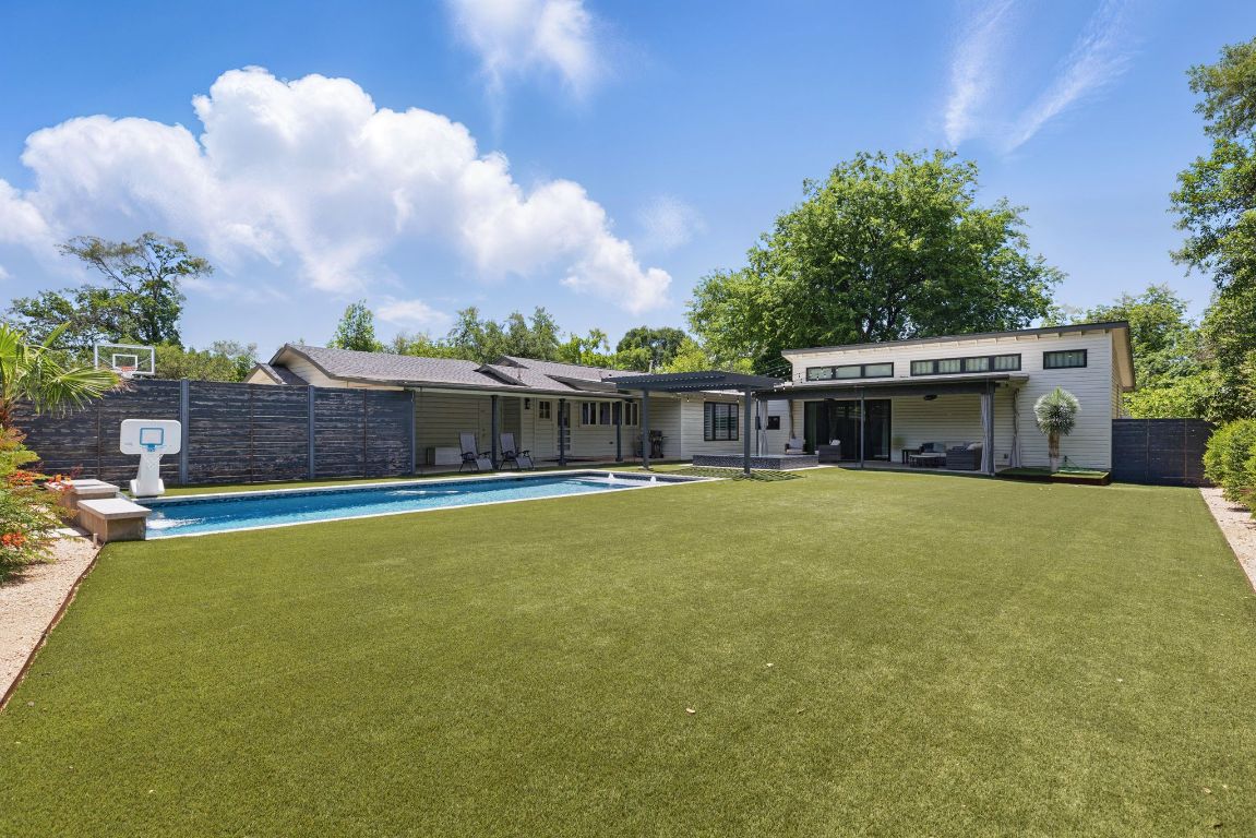 6010 Nasco Drive Austin, TX 78757 - Photo 27 of 34 a swimming pool with outdoor seating and yard