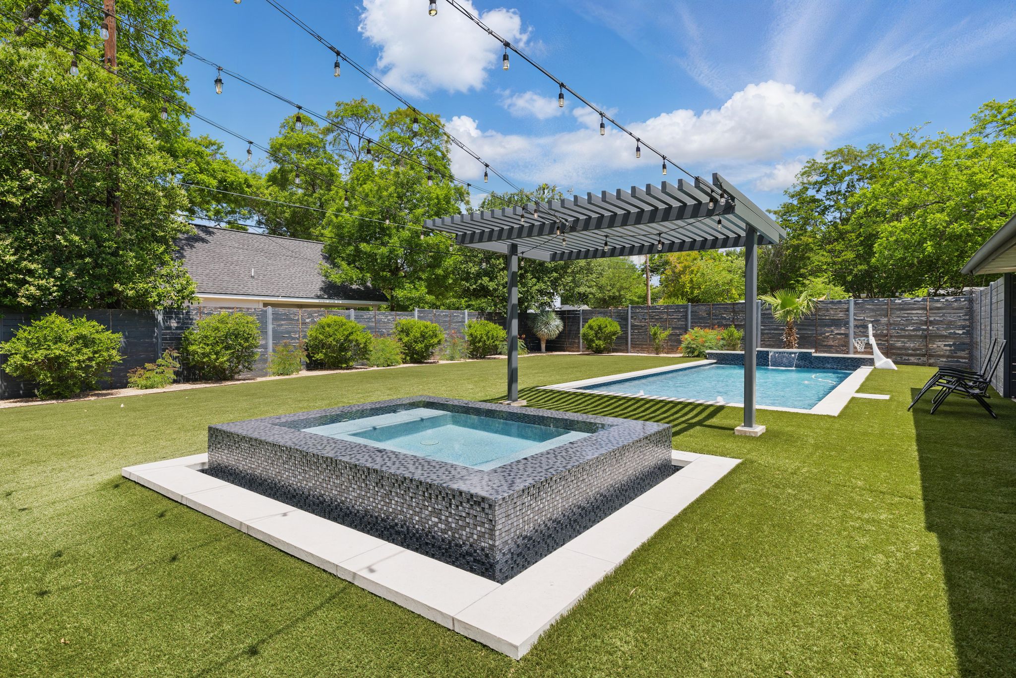 6010 Nasco Drive Austin, TX 78757 - Photo 30 of 34 a view of a backyard with a fountain