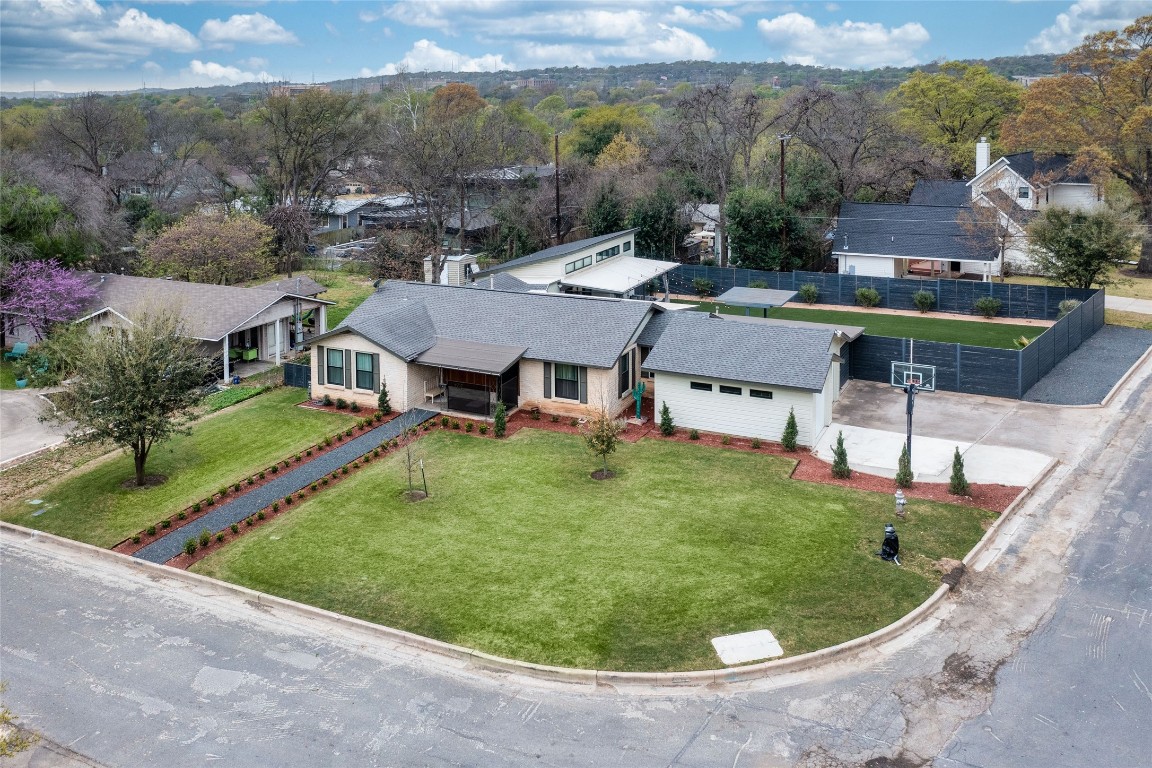 6010 Nasco Drive Austin, TX 78757 - Photo 31 of 34 an aerial view of a house with swimming pool garden and mountain view