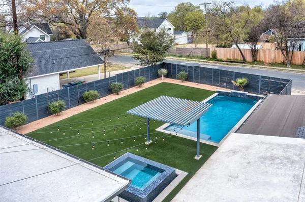 a view of a backyard with sitting area