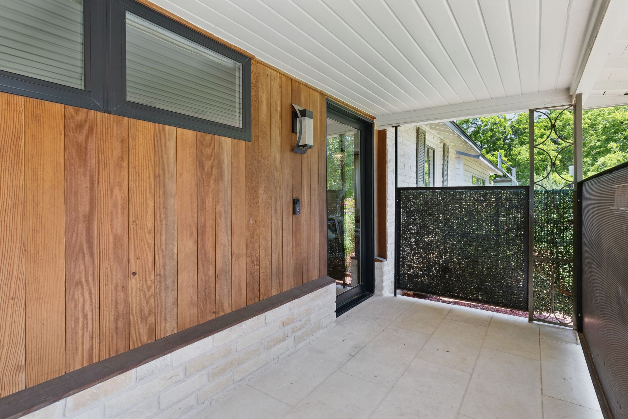 6010 Nasco Drive Austin, TX 78757 - Photo 6 of 34 a view of a porch with wooden floor and garden
