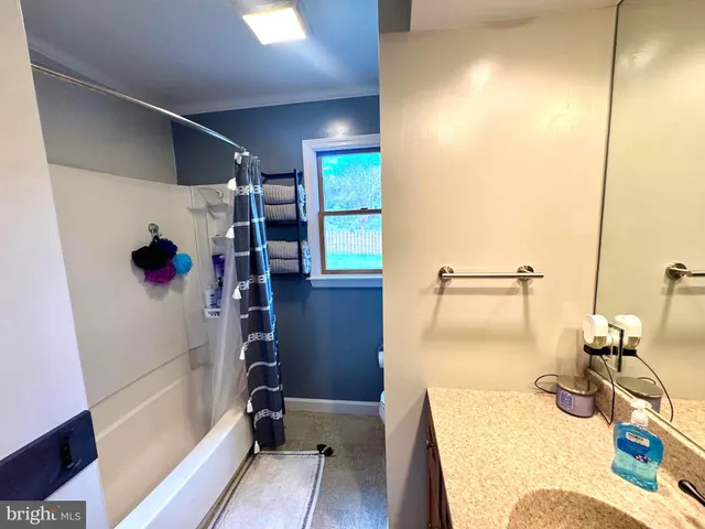a bathroom with a sink and mirror