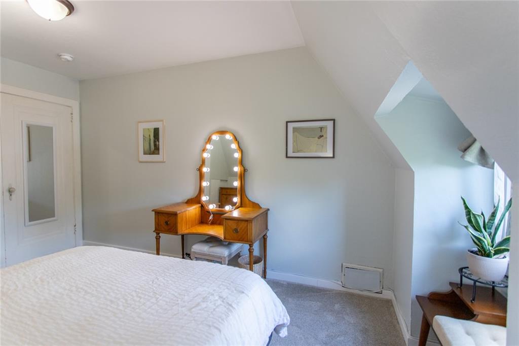 3211 Willett Road Pittsburgh, PA 15227 - Photo 18 of 27 a bed room with a bed and a chair