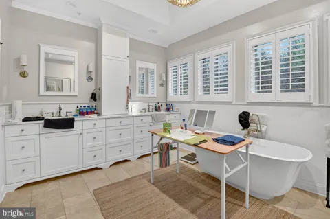 a kitchen that has a table and chairs in it