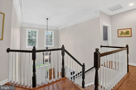 a view of an entryway with wooden floor