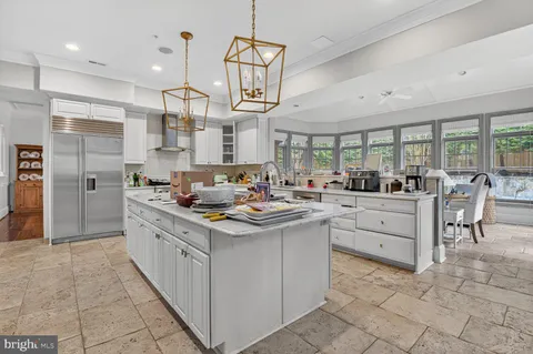 a kitchen with cabinets a sink and appliances