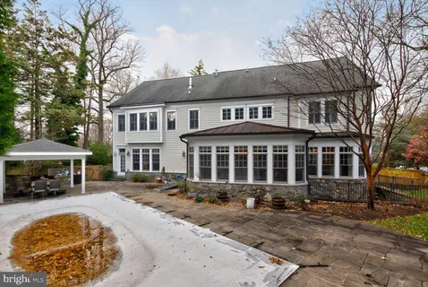 a front view of a house with a yard table and chairs