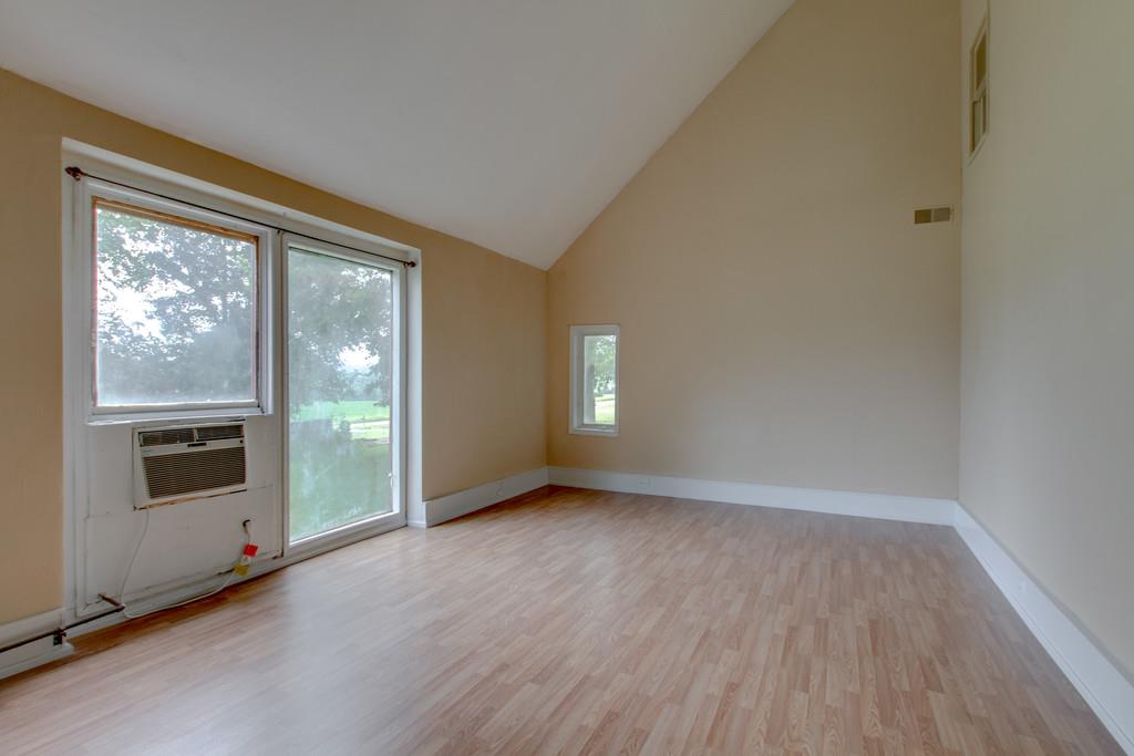 4314 Kinneys Road Springfield, TN 37172 - Photo 7 of 28 an empty room with wooden floor and windows