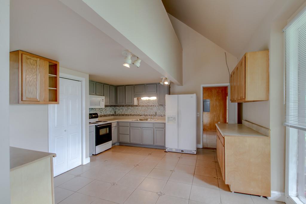 4314 Kinneys Road Springfield, TN 37172 - Photo 8 of 28 a kitchen with a refrigerator and a sink
