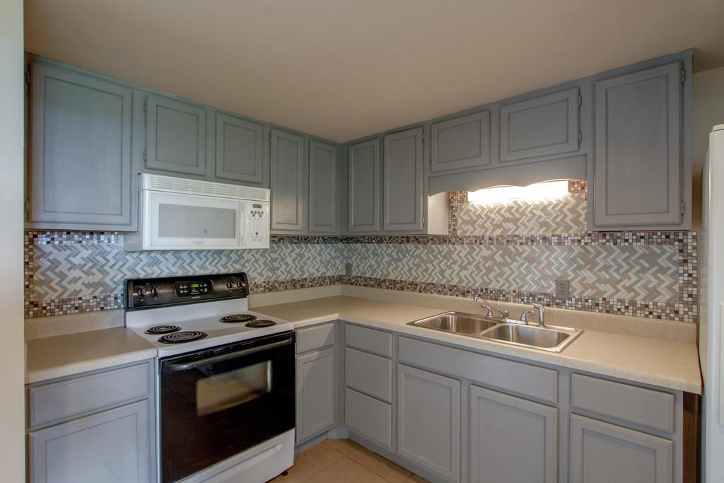 4314 Kinneys Road Springfield, TN 37172 - Photo 9 of 28 a kitchen with a sink stove and cabinets