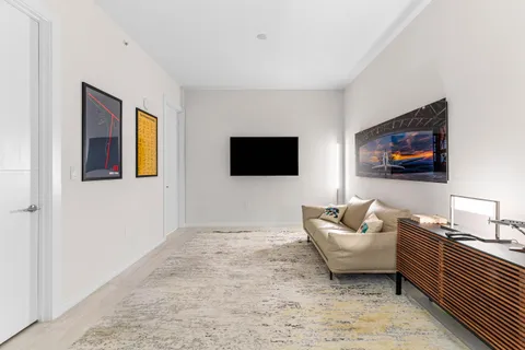 a bedroom with a large bed and a large window