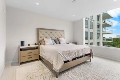 a view of a living room and floor to ceiling window or kitchen