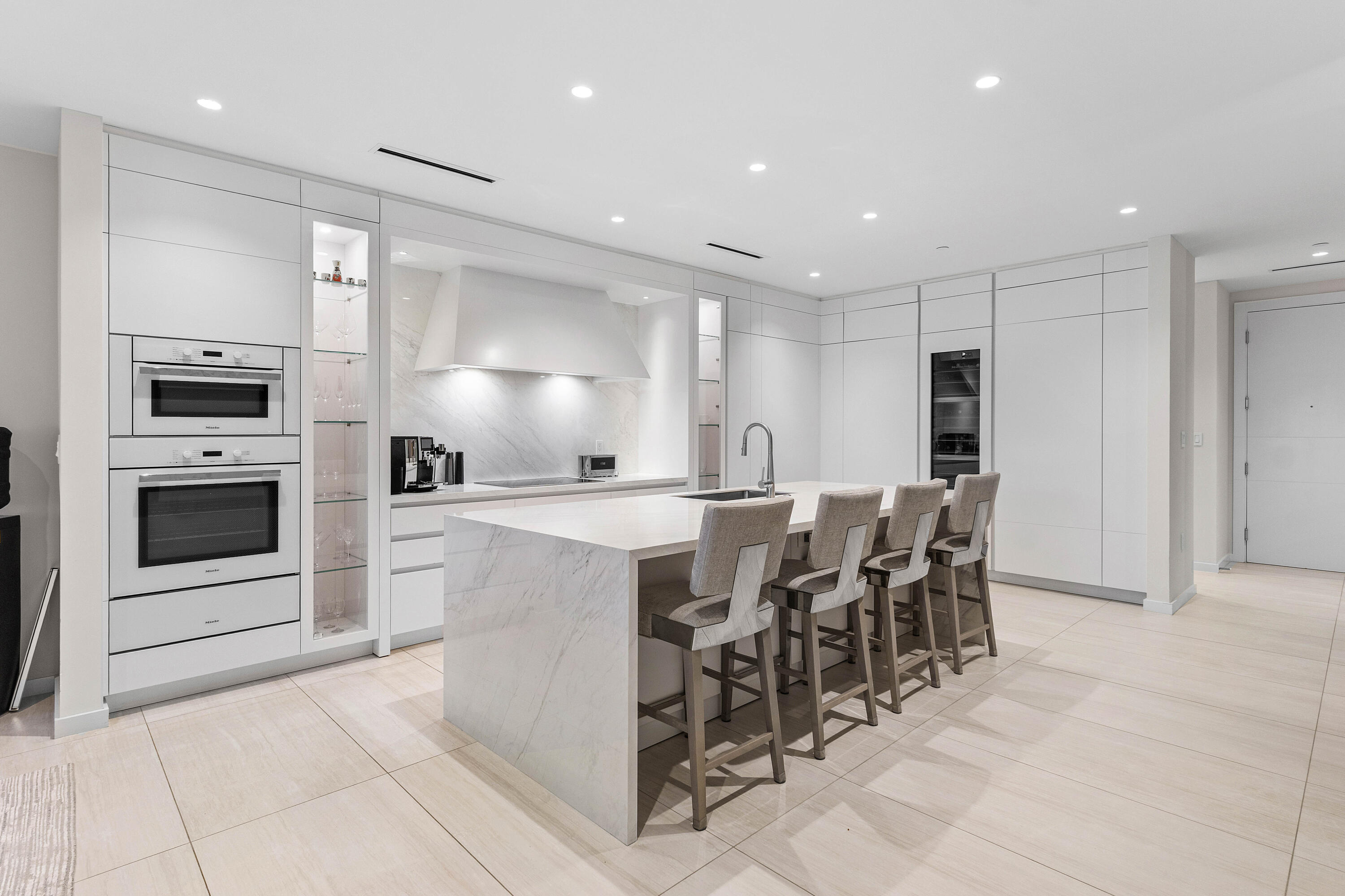 200 Southeast Mizner Boulevard, Unit 707 Boca Raton, FL 33432 - Photo 3 of 119 a large kitchen with a table and chairs