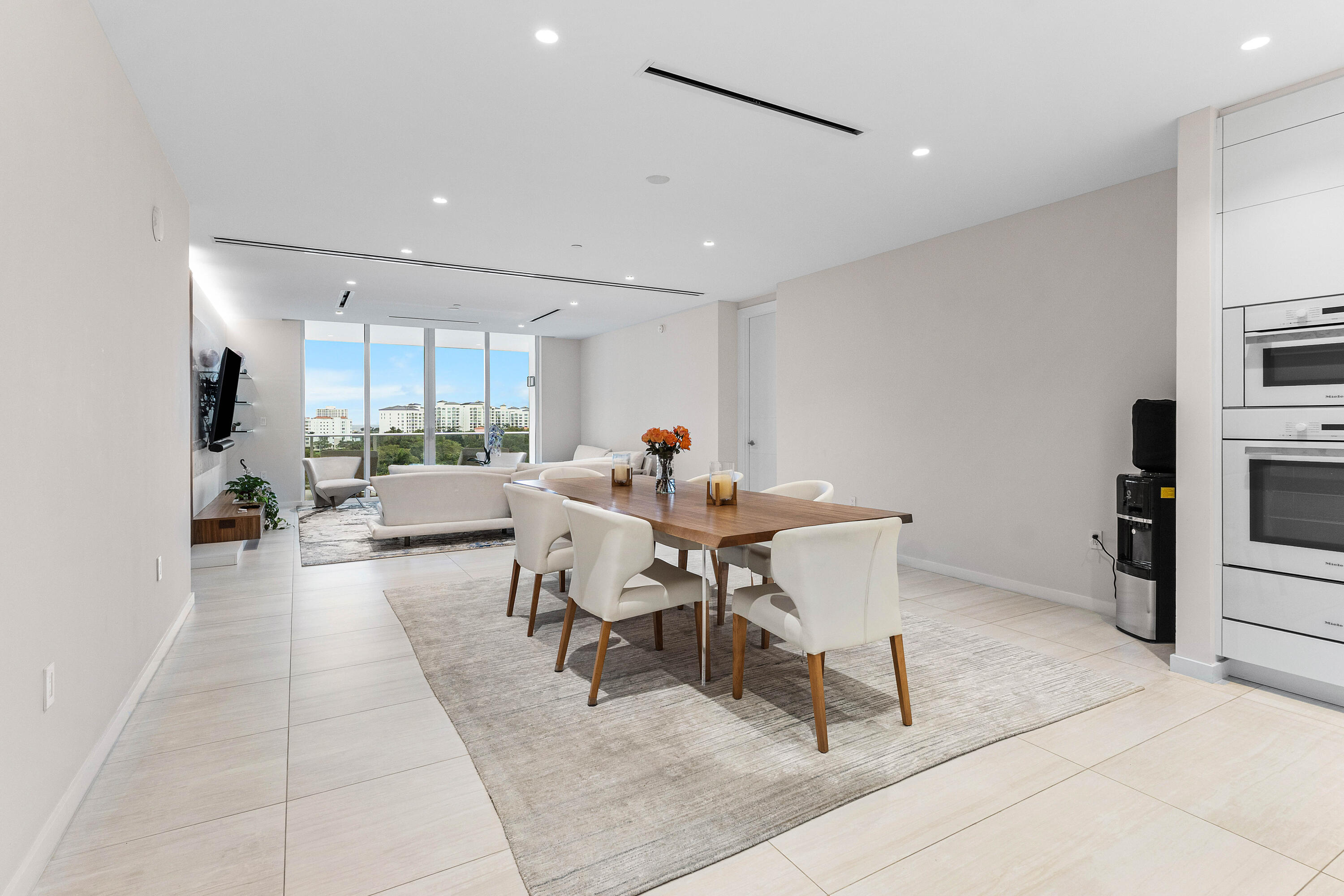 200 Southeast Mizner Boulevard, Unit 707 Boca Raton, FL 33432 - Photo 6 of 119 a work room with furniture a rug and a view of kitchen