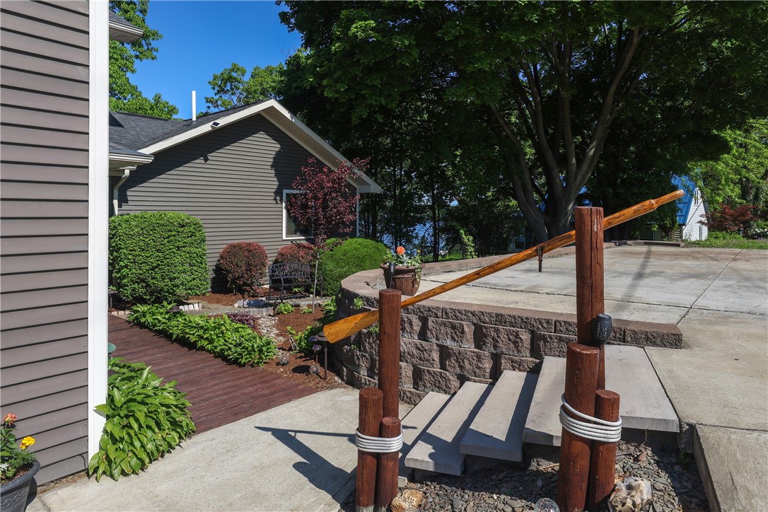 5580 Peach Orchard Road Hector, NY 14841 - Photo 5 of 50 concrete parking area with steps to front garden a