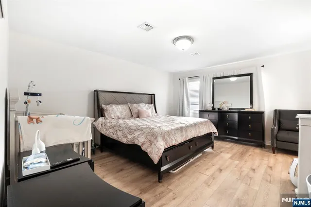 a white bath tub sitting next to a white sink