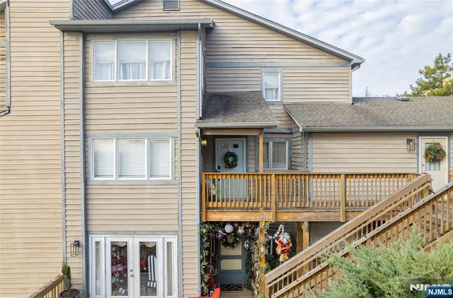 a view of multiple houses with yard