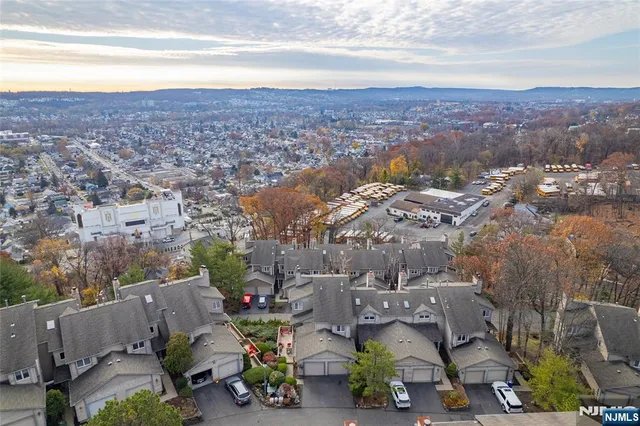 a kitchen with stainless steel appliances kitchen island granite countertop a stove a sink and a microwave