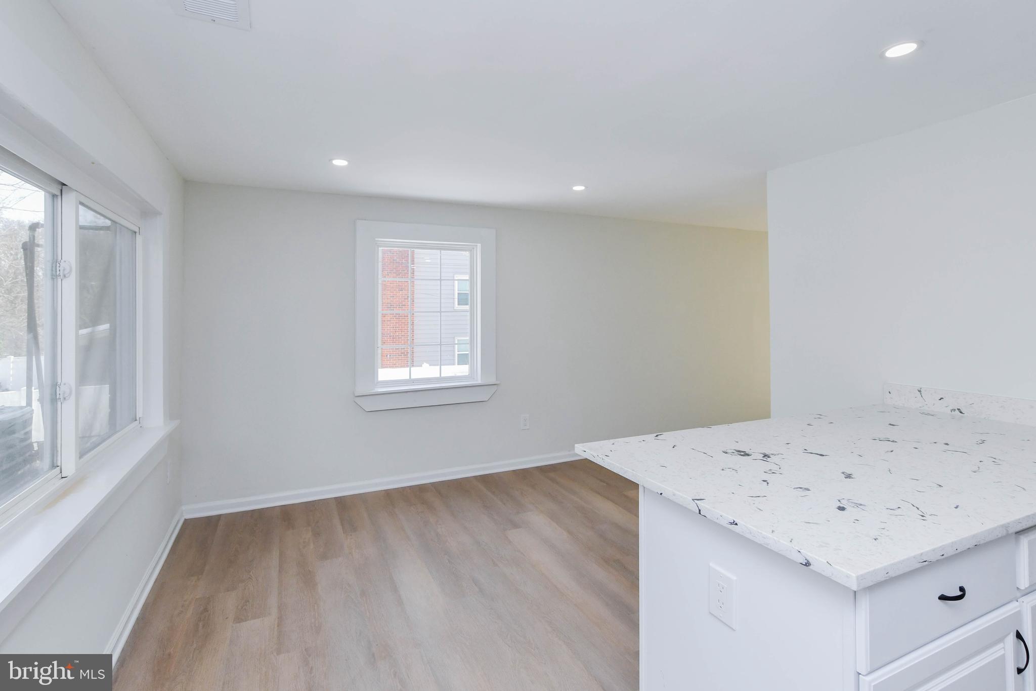 8130 Sheriff Road Landover, MD 20785 - Photo 14 of 36 a view of a room that has a sink a window and wooden floor