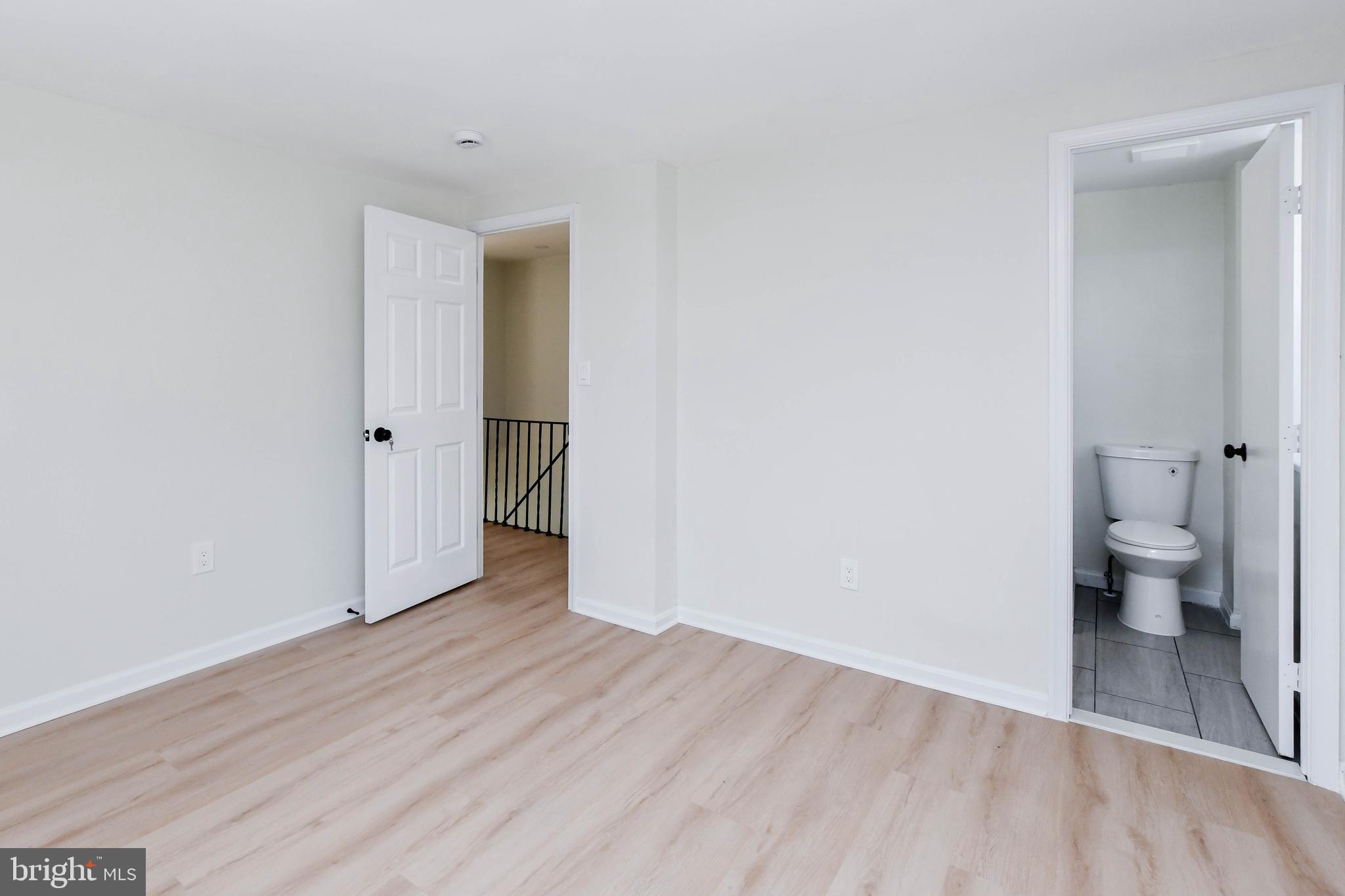 8130 Sheriff Road Landover, MD 20785 - Photo 22 of 36 a view of a room with wooden floor and a toilet