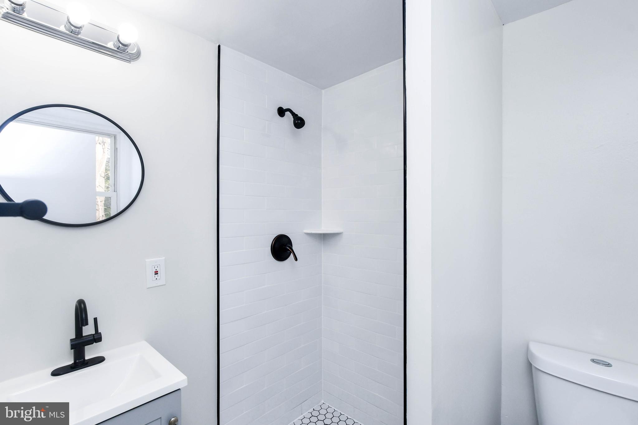 8130 Sheriff Road Landover, MD 20785 - Photo 23 of 36 a bathroom with a sink and a mirror