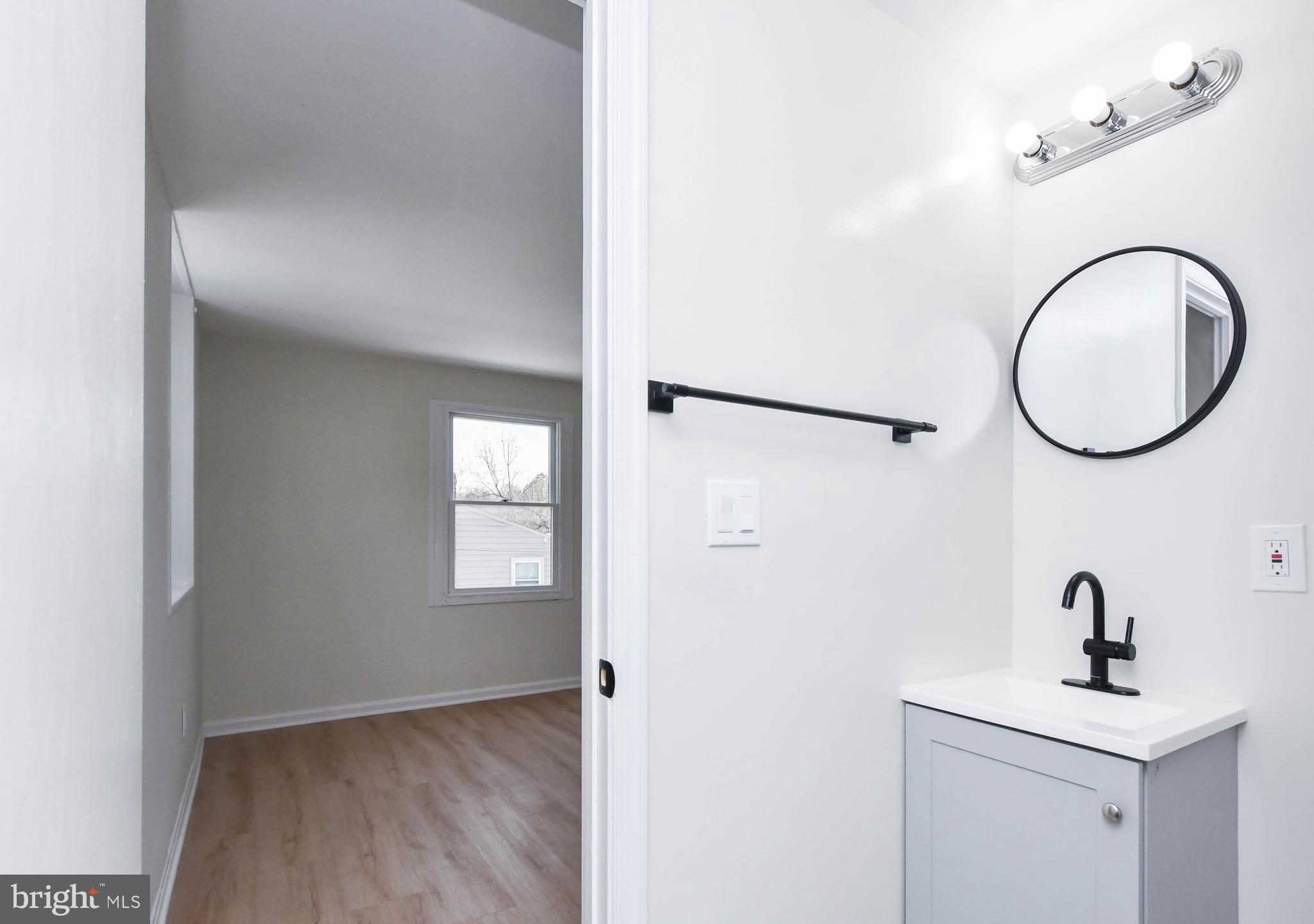 8130 Sheriff Road Landover, MD 20785 - Photo 24 of 36 a view of a room with wooden floor and mirror