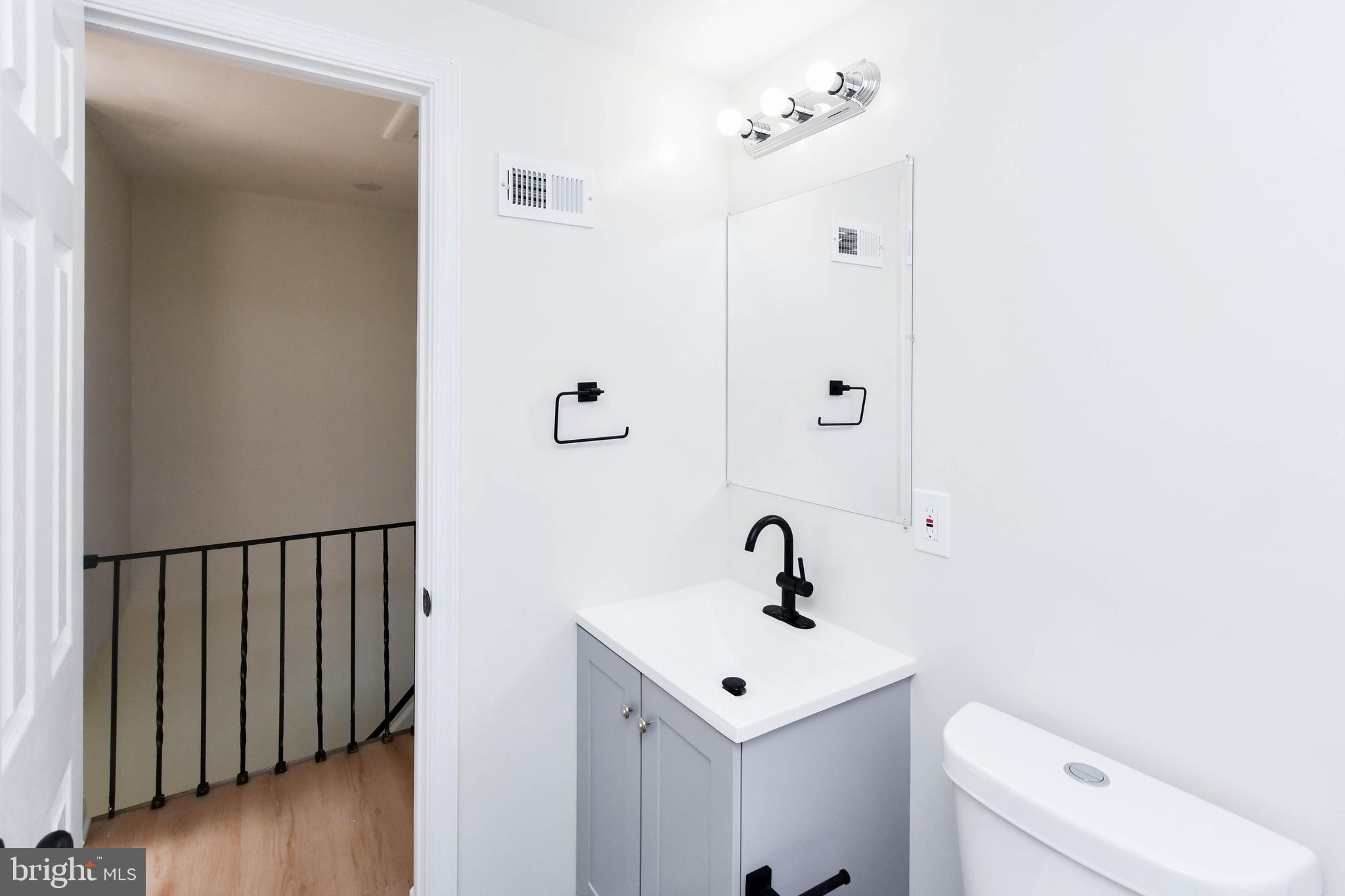 8130 Sheriff Road Landover, MD 20785 - Photo 28 of 36 a bathroom with a sink a toilet and shower