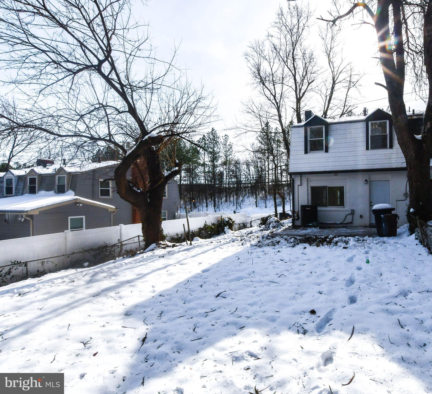 8130 Sheriff Road Landover, MD 20785 - Photo 33 of 36 a front view of a house with a yard covered with snow in front of house