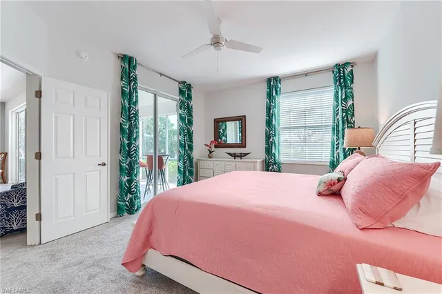 a bed room with a bed and a window