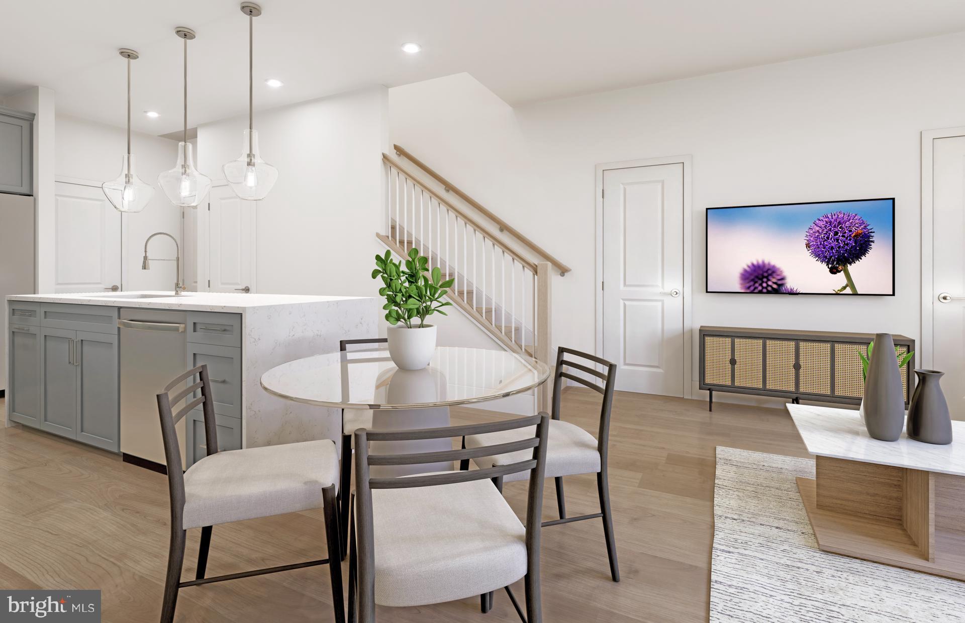 19844 Lavender Dust Square Ashburn, VA 20147 - Photo 4 of 22 a view of a dining room with furniture and a potted plant