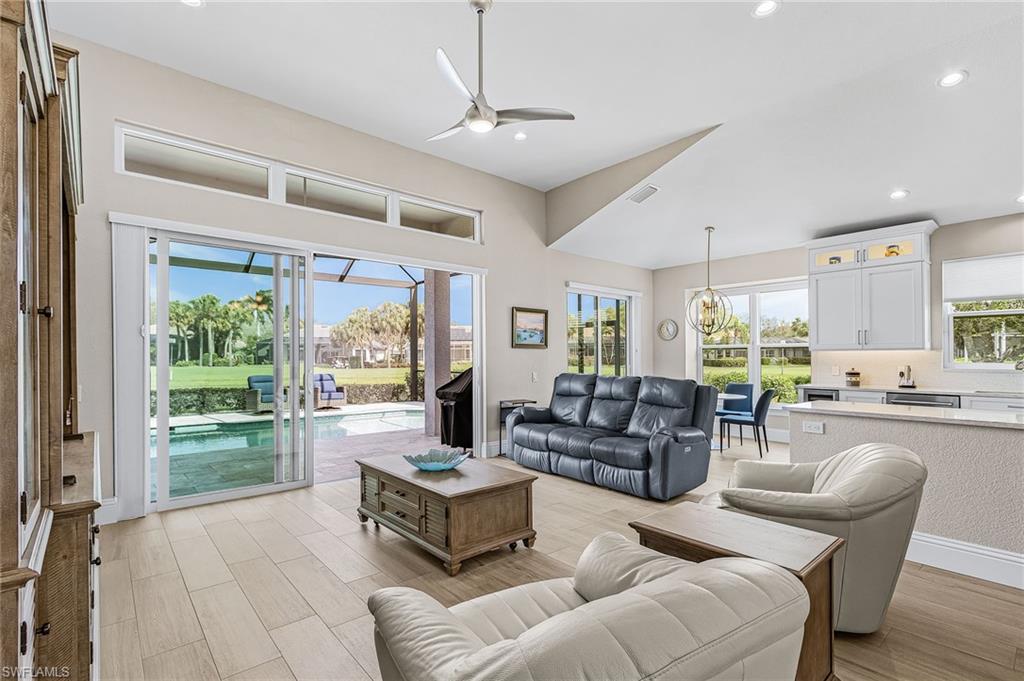 1799 Langford Lane Naples, FL 34109 - Photo 6 of 25 a living room with furniture and a large window