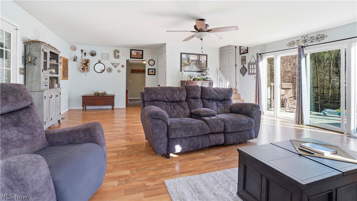 65892 Endley Road Cambridge, OH 43725 - Photo 17 of 50 Living area featuring a ceiling fan and light wood finished floors