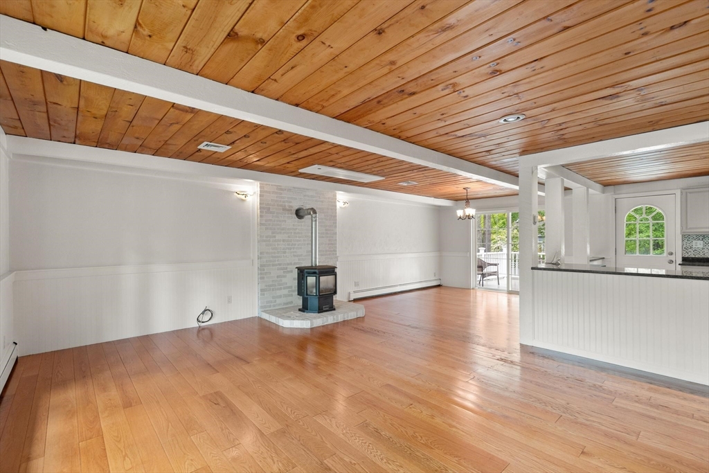 901 Haverhill Street Rowley, MA 01969 - Photo 10 of 42 a view of a room with window and wooden floor
