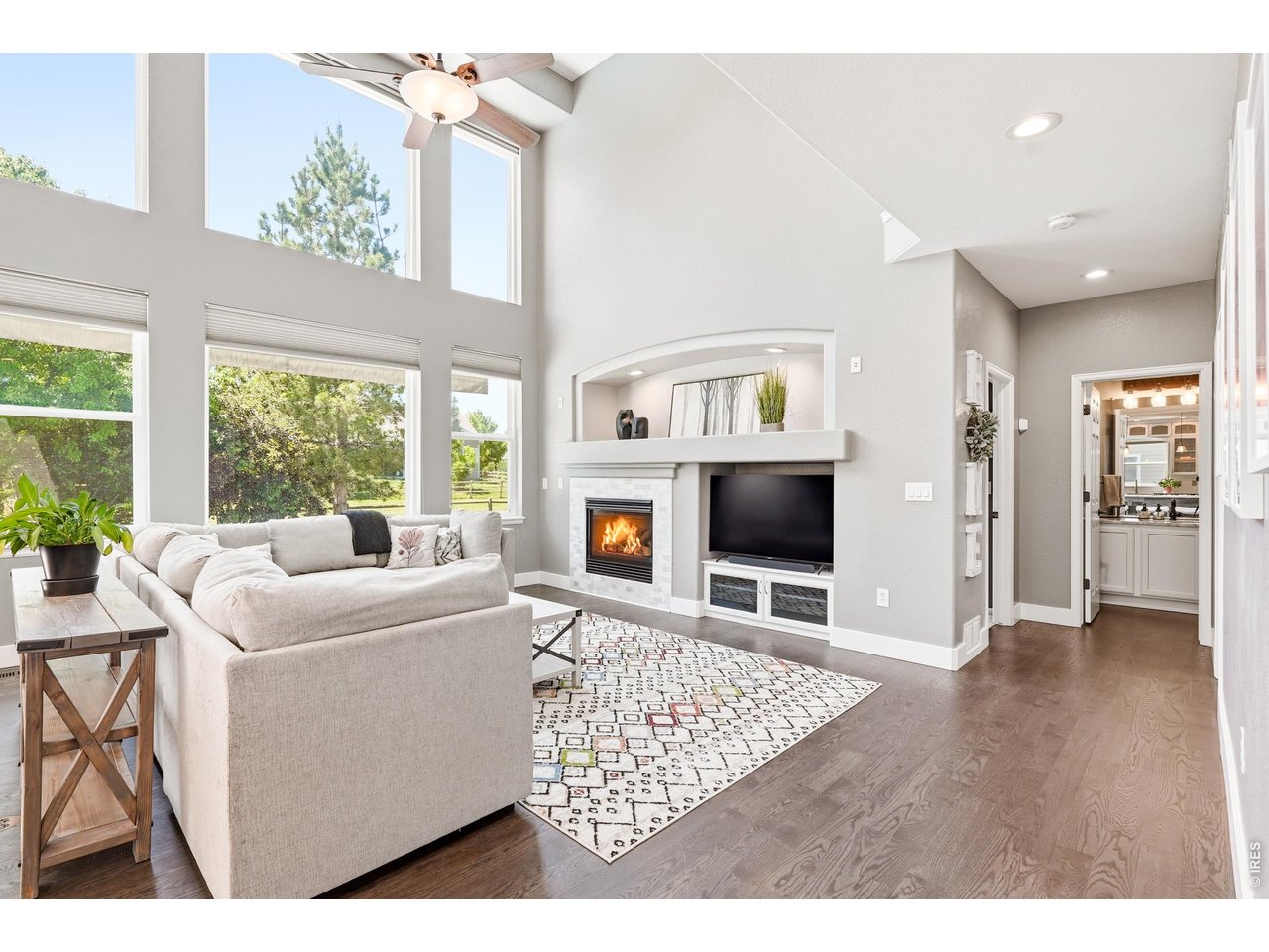 11725 Pleasant Hill Road Longmont, CO 80504 - Photo 8 of 50 The expansive living room, with a gas fireplace and soaring windows